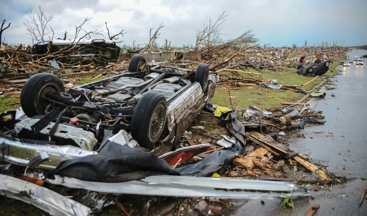 a car that is sitting on top of a pile of debris
