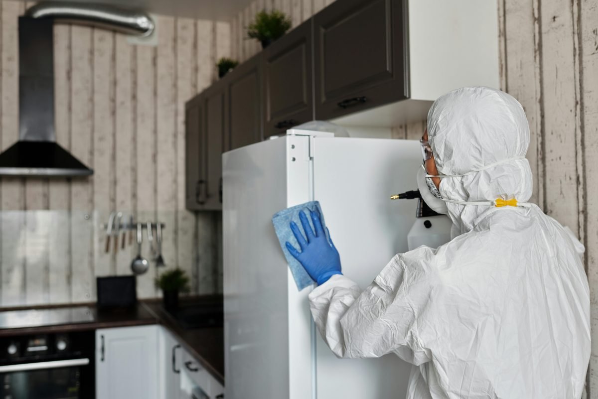 Person In A Protective Suit doing home maintenance