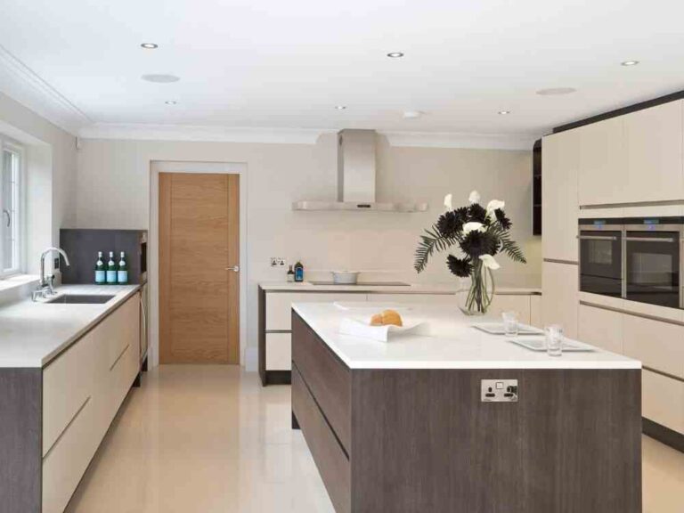 An image of an island kitchen layout of a home interior space.