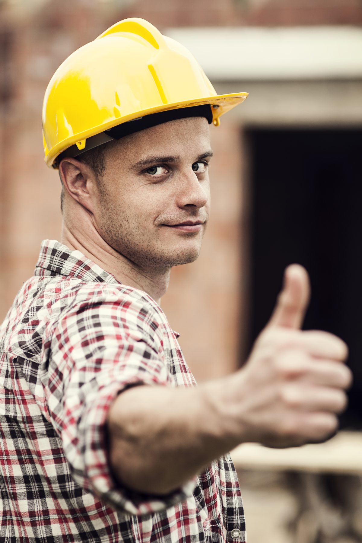 An image of a home owner-builder giving a thumbs up. 