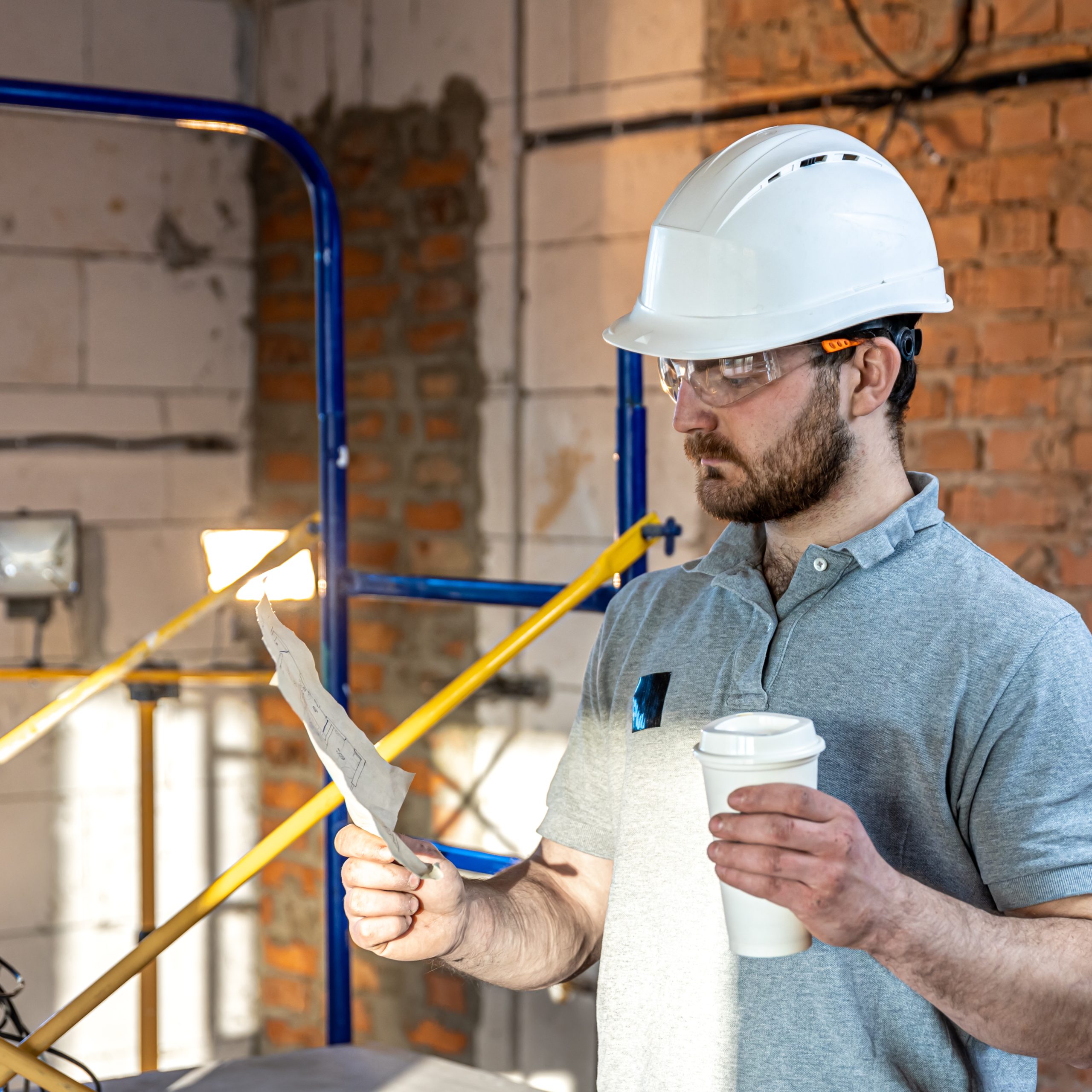 An image of an owner-builder going through his plans. 