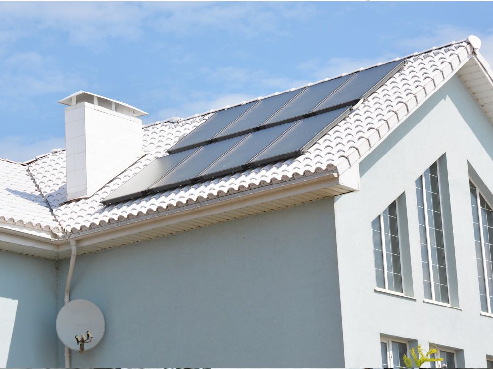 An image of solar panels on a roof. 