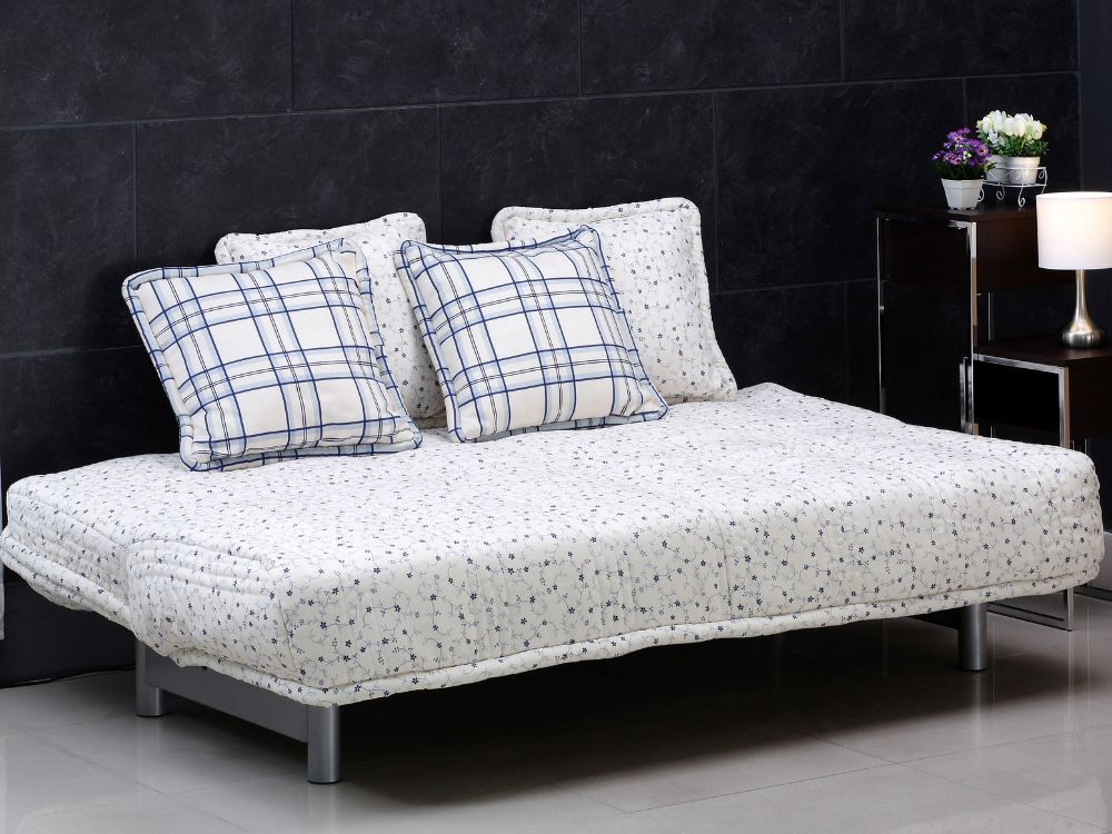 An image of a white futon sofa bed. 