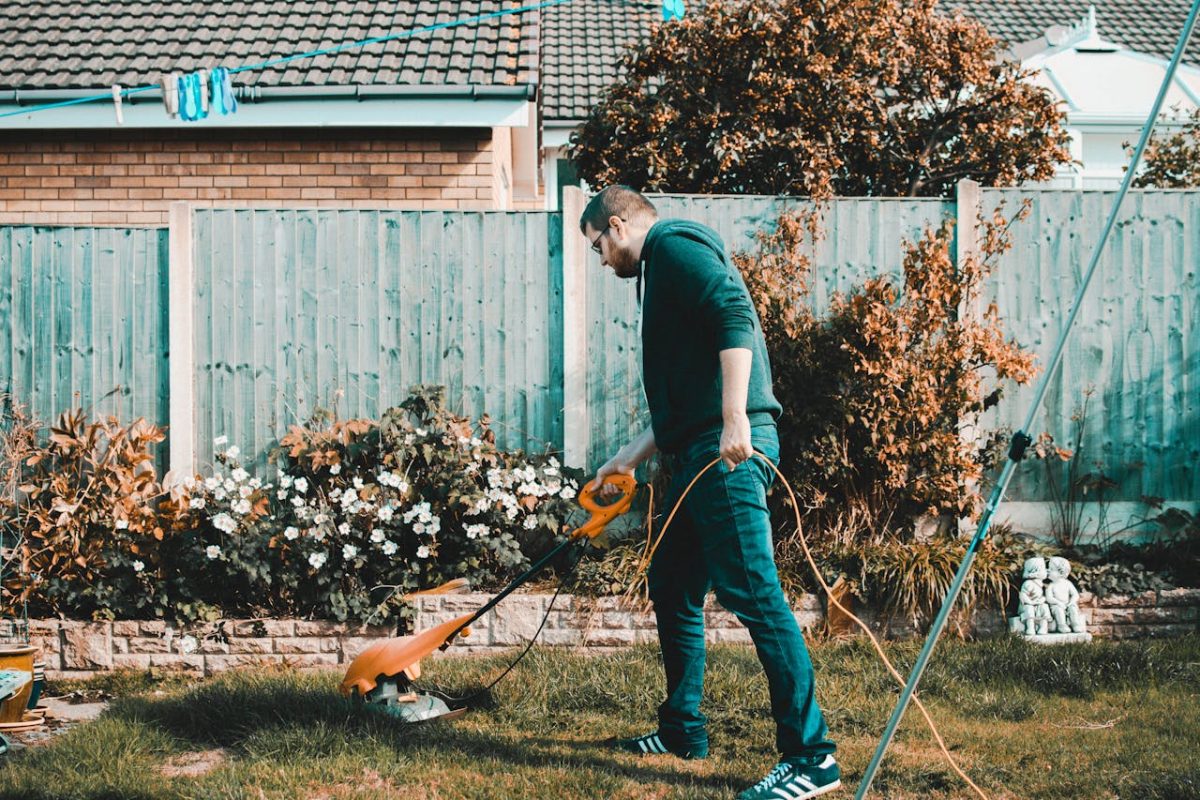 a man maintaining his grass