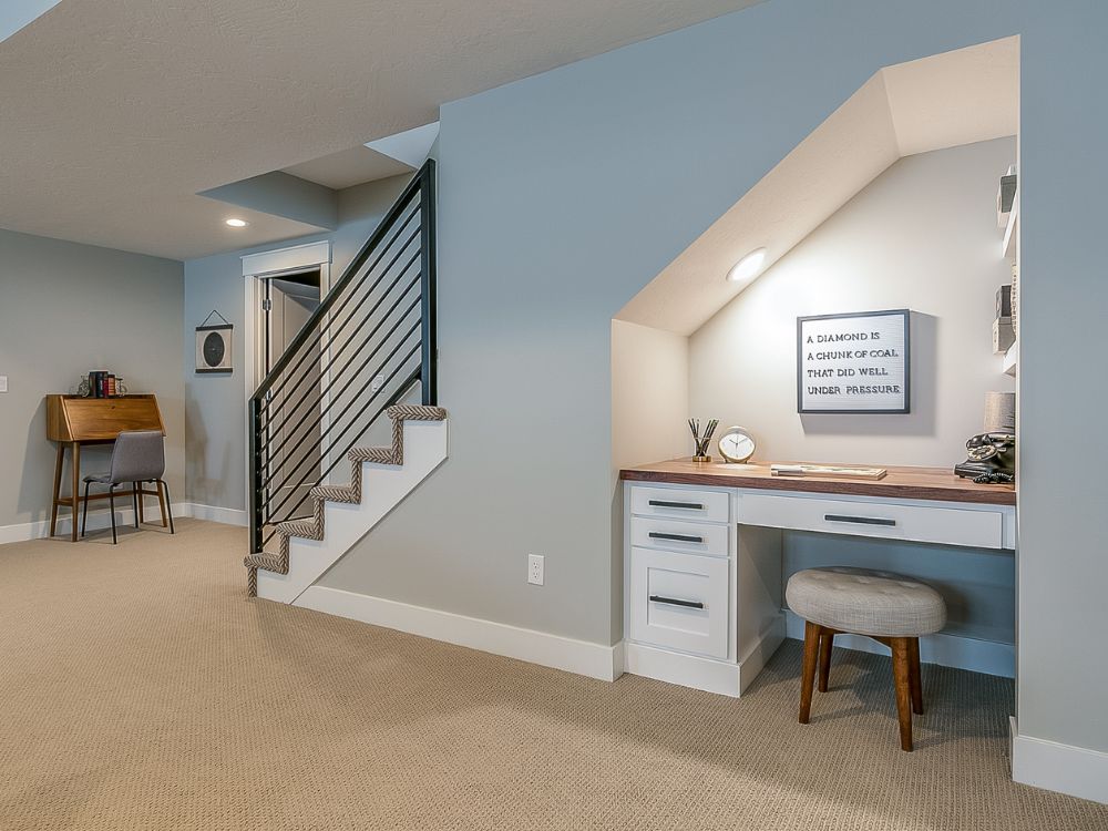 An image of a finished basement used as a remote-work station.