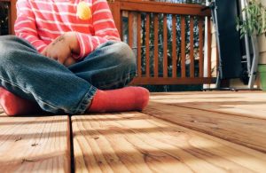 An image of a kid playing in a patio.