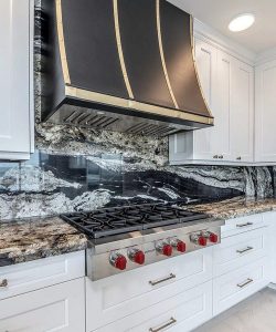 Bold Elegance in Action: A Contemporary Kitchen Anchored by a Statement Range Hood