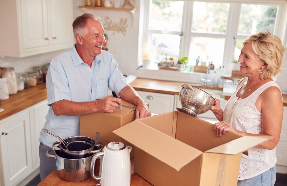 An image of seniors packing their belongings. 