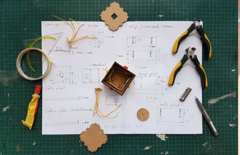 An image of a blueprint and tools.