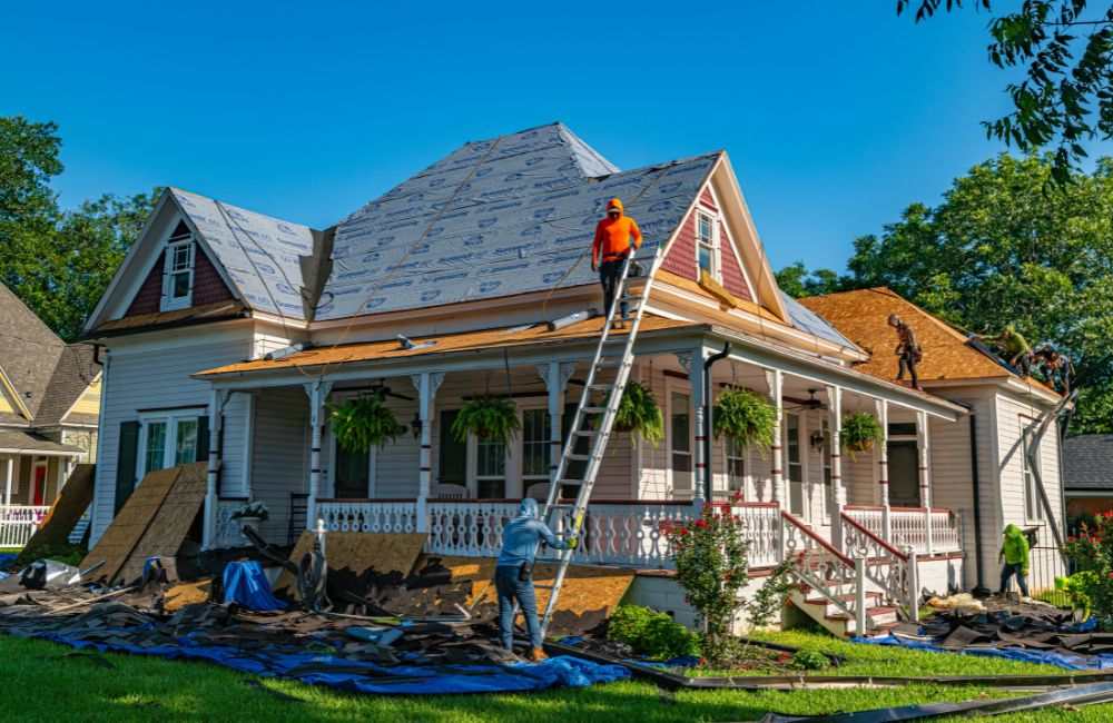 An image of contractors working on the roofing.