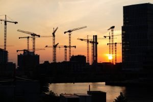 A skyline of construction cranes
