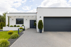 Choosing the Right Garage Door for Your Owner-Built Home: Climate Considerations, Energy Efficiency, and Long-Term Value