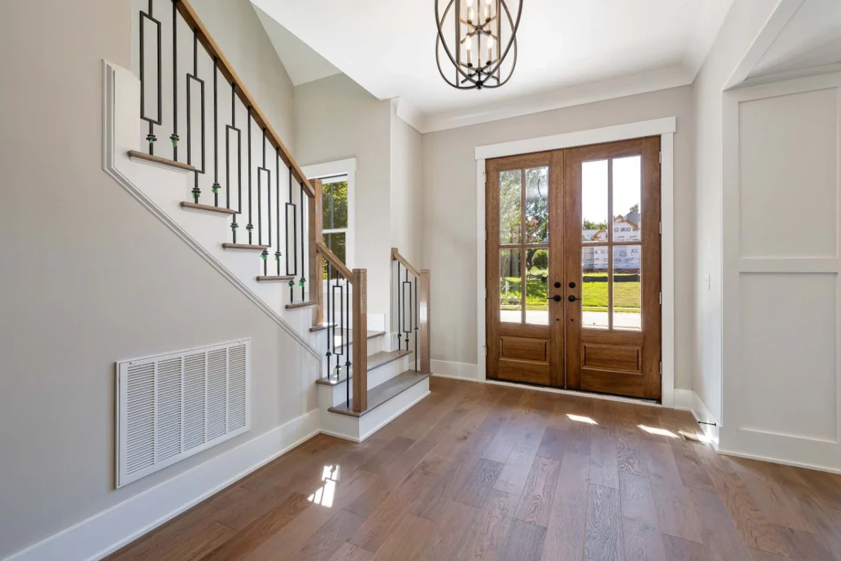 A timber entry door with glass highlights.